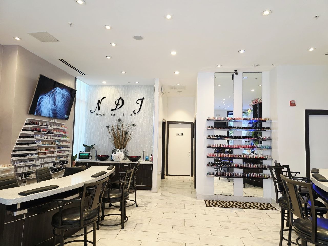 A bright view of the salon's manicure and beauty stations